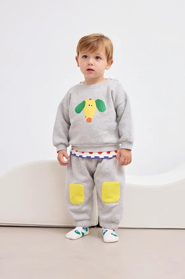 Bobo Choses Bombažen pulover za dojenčka Bobo Choses Happy Dog siva barva, 125AB029