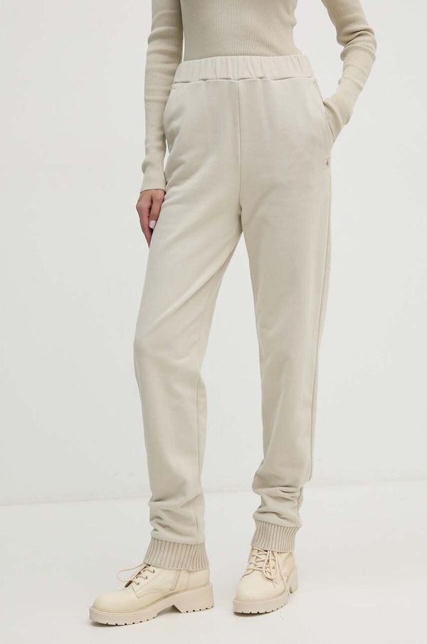 Calvin Klein Jeans Bombažen spodnji del trenirke Calvin Klein Jeans zelena barva, J20J224443