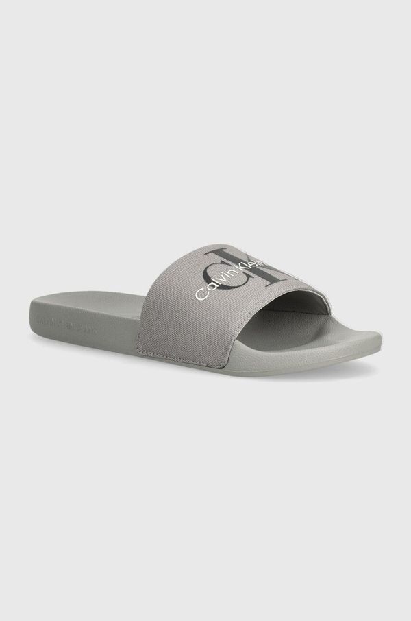 Calvin Klein Jeans Natikači Calvin Klein Jeans SLIDE MONOGRAM CO moški, oranžna barva, YM0YM00061