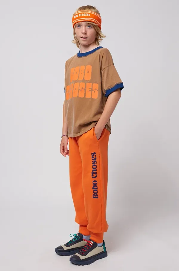 Bobo Choses Otroška bombažna trenirka Bobo Choses oranžna barva, 125AC140