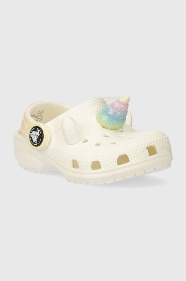 Crocs Otroški natikači Crocs CLASSIC IAM RAINBOW UNICORN CLOG bež barva