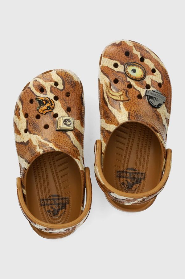 Crocs Otroški natikači Crocs JURASSIC WORLD CLASSIC CLOG rjava barva