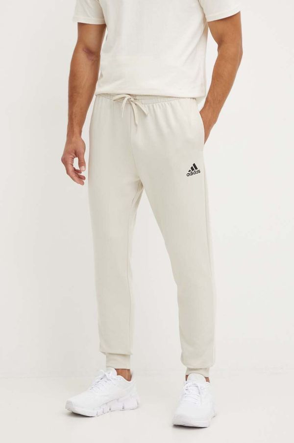 adidas Spodnji del trenirke adidas Essentials bež barva, JH1039