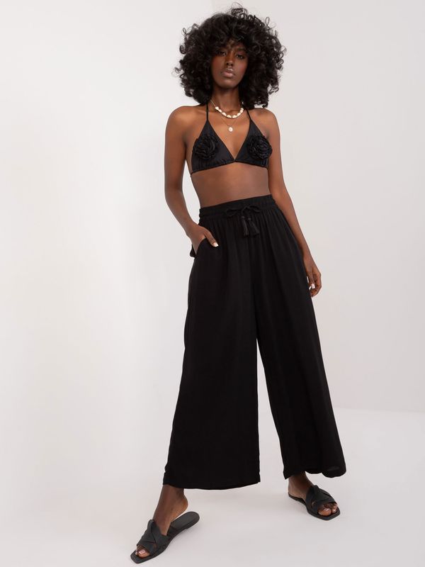 Fashionhunters Black loose palazzo trousers with elastic waistband SUBLEVEL