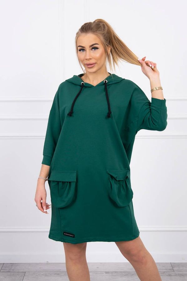 Kesi Dark green dress with a hood