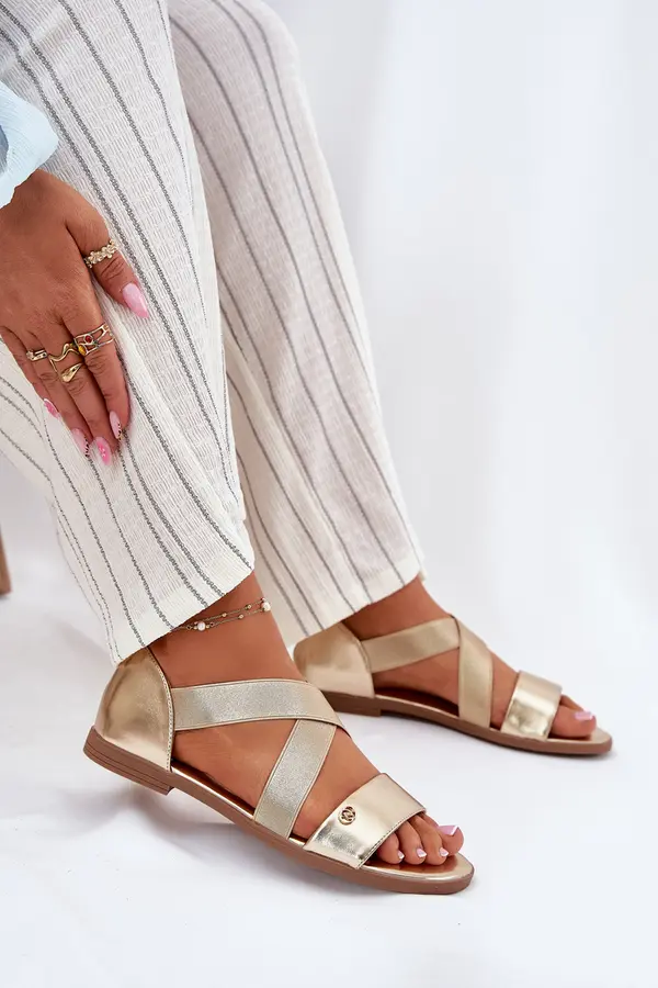 EVENTO EVENTO Womens flat sandals with elastic straps gold Marinea