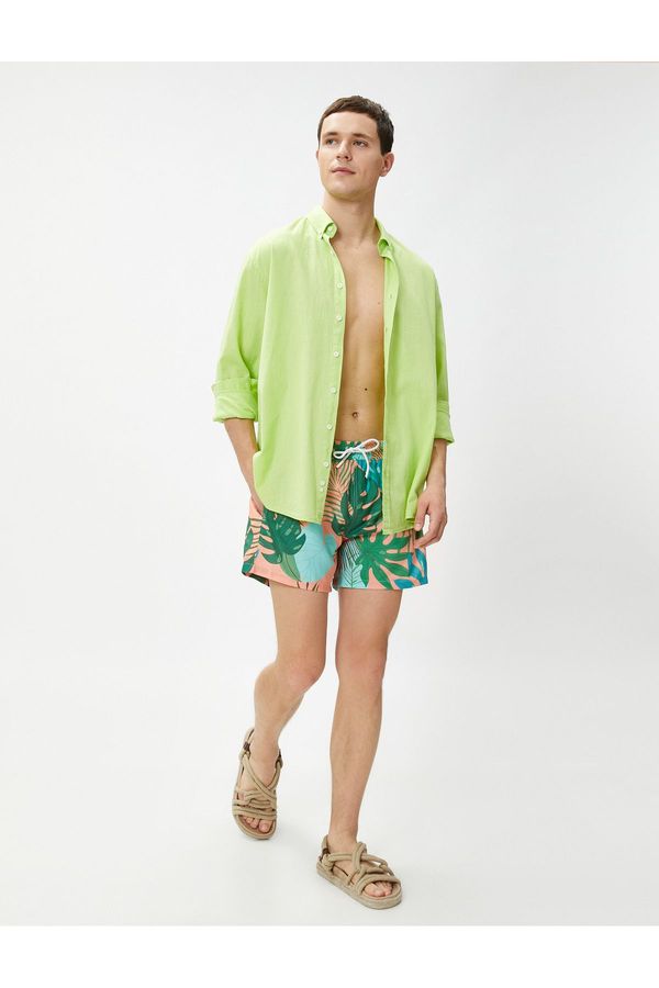 Koton Koton Marine Shorts with a Tropical Print Tie Waist, Pocket Detailed.