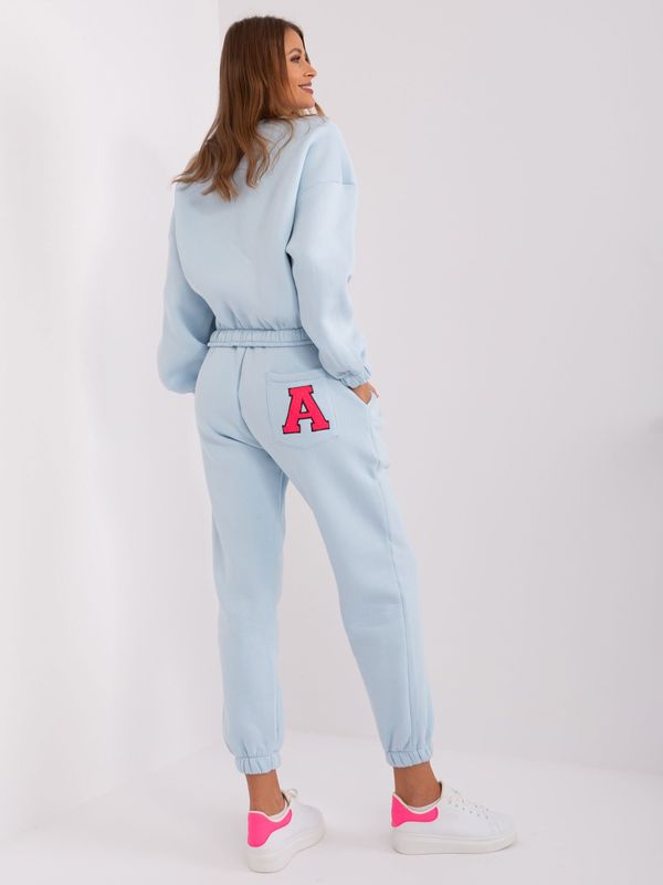 Fashionhunters Light blue and fluorine pink tracksuit with sweatshirt