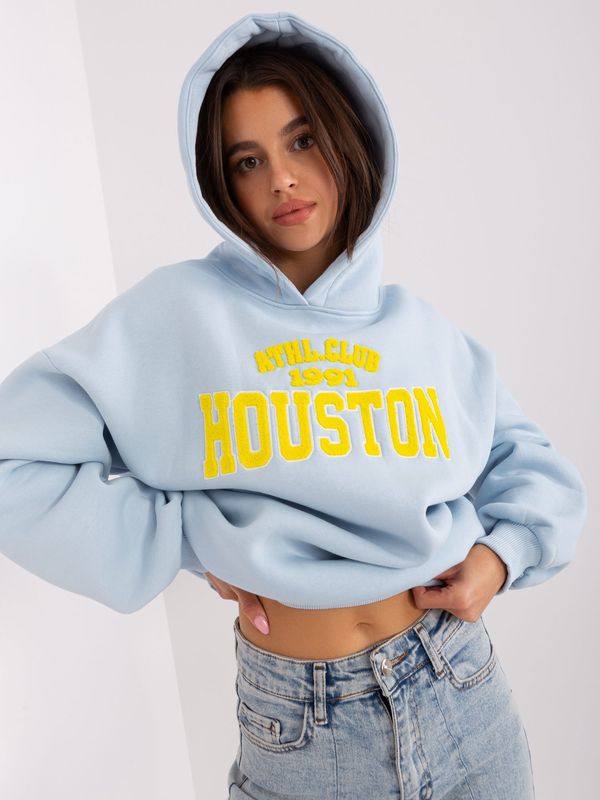 Fashionhunters Light blue women's sweatshirt with inscription