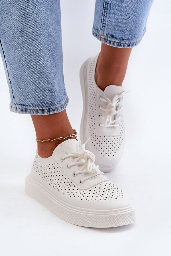 Kesi Openwork sneakers on a white Tanvi platform