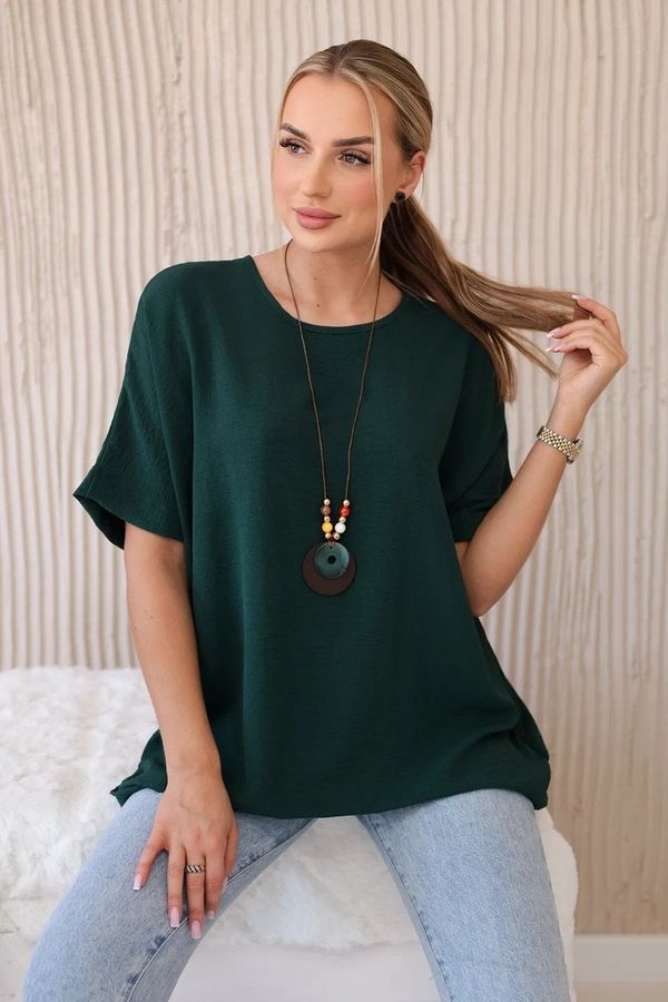 Kesi Oversized blouse with a pendant in dark green color