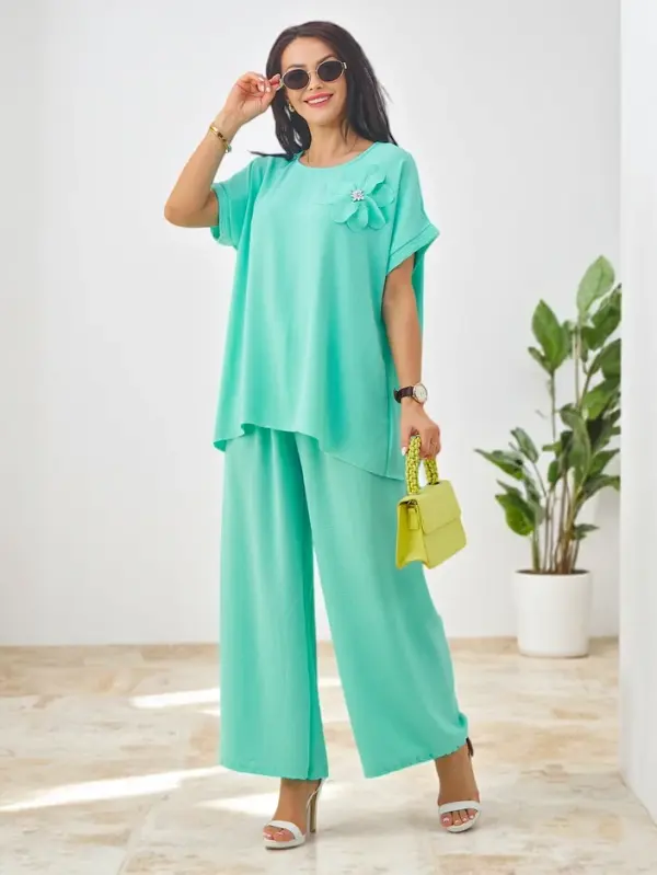 Resti Resti Women's set with short sleeves, decorative flower and wide pants