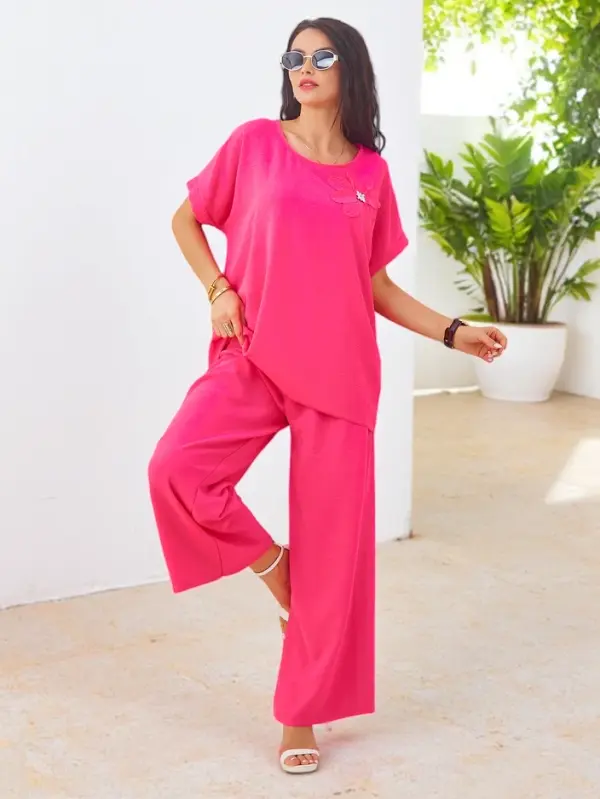 Resti Resti Women's set with short sleeves, decorative flower, and wide trousers