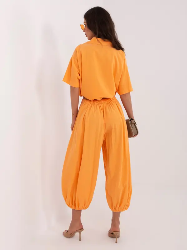 Italy Moda Svetlo oranžne hlače z čepki