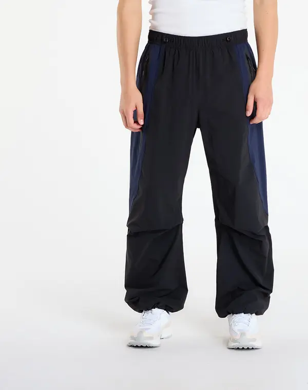 Nike Hlače Nike Tech Men's Dri-FIT Woven Color-Block Oversized Pants Black/ Obsidian/ Black M