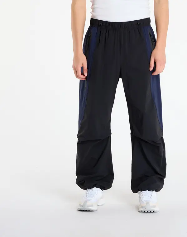 Nike Hlače Nike Tech Men's Dri-FIT Woven Color-Block Oversized Pants Black/ Obsidian/ Black S