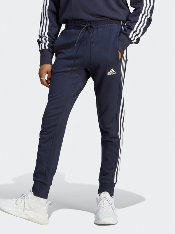 adidas adidas Spodnji del trenirke Essentials French Terry Tapered Cuff 3-Stripes Joggers IC9406 Modra Regular Fit