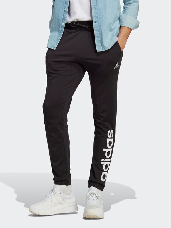 adidas adidas Spodnji del trenirke Essentials Single Jersey Tapered Elasticized Cuff Logo Joggers IC0055 Črna Regular Fit