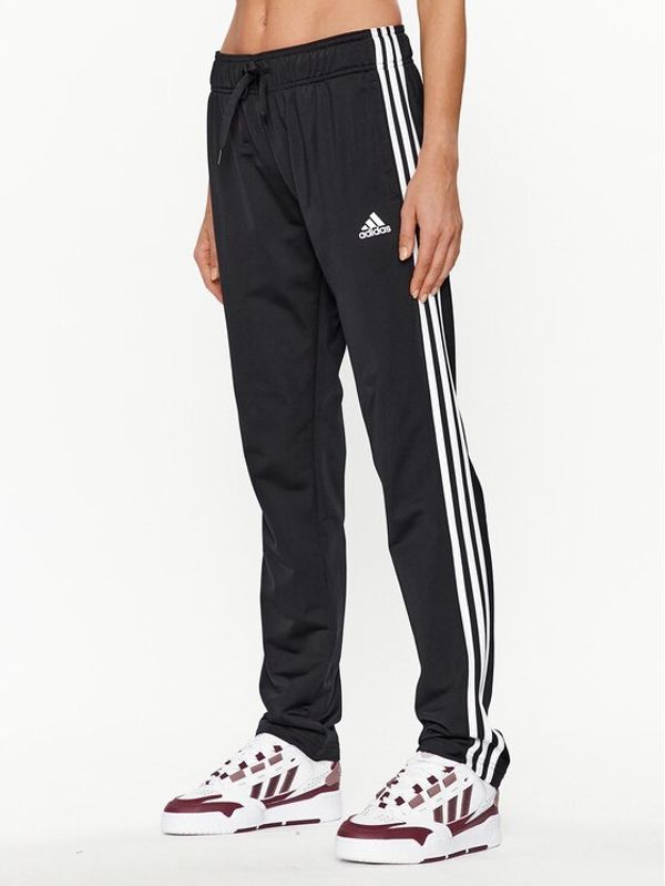 adidas adidas Spodnji del trenirke Essentials Warm-Up 3-Stripes H48451 Črna Regular Fit