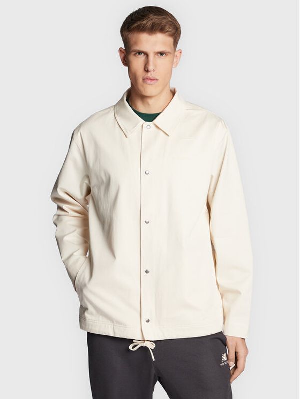 New Balance New Balance Prehodna jakna Athletics Nature State MJ23552 Bež Relaxed Fit