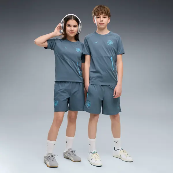 PUMA Manchester City PUMATECH Relaxed Woven Shorts Youth, Clothing, Evening Sky/Luminous Blue, 15-16Y